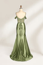 A mannequin displays a rose - gold satin gown. It has thin straps, off - shoulder lace - detailed sleeves, a ruched bodice, and a high side slit. The elegant design, blending satin and lace, suits formal events like galas or weddings.2