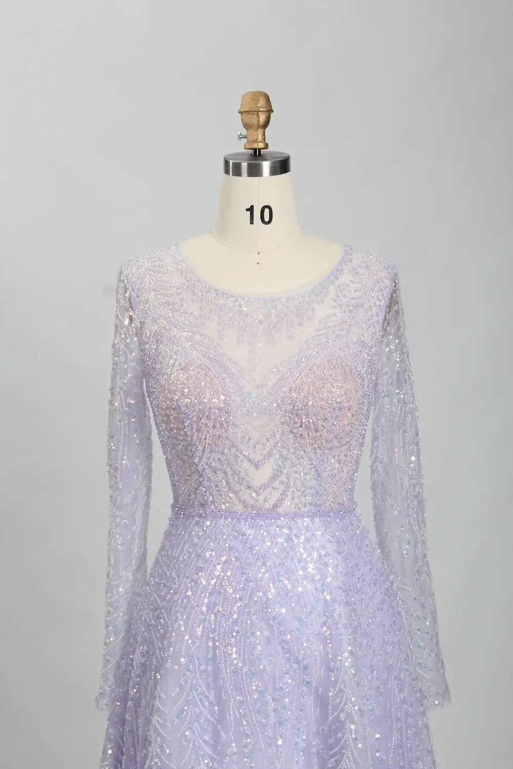 Lavender illusion long-sleeve A-line mother of the bride dress with V-neck beaded detail.