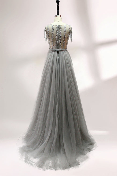 Gray tulle evening dress with beaded bodice, open back, and shoulder fringe