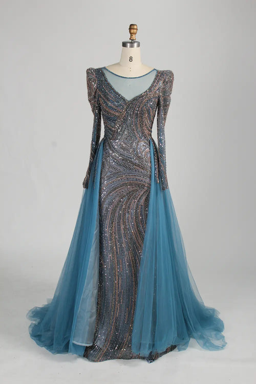Dusty blue mermaid tulle overskirt gown with long sleeves and allover beading