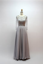 Grey beaded tulle gown with long sleeves, lace bodice, and flowing A-line skirt