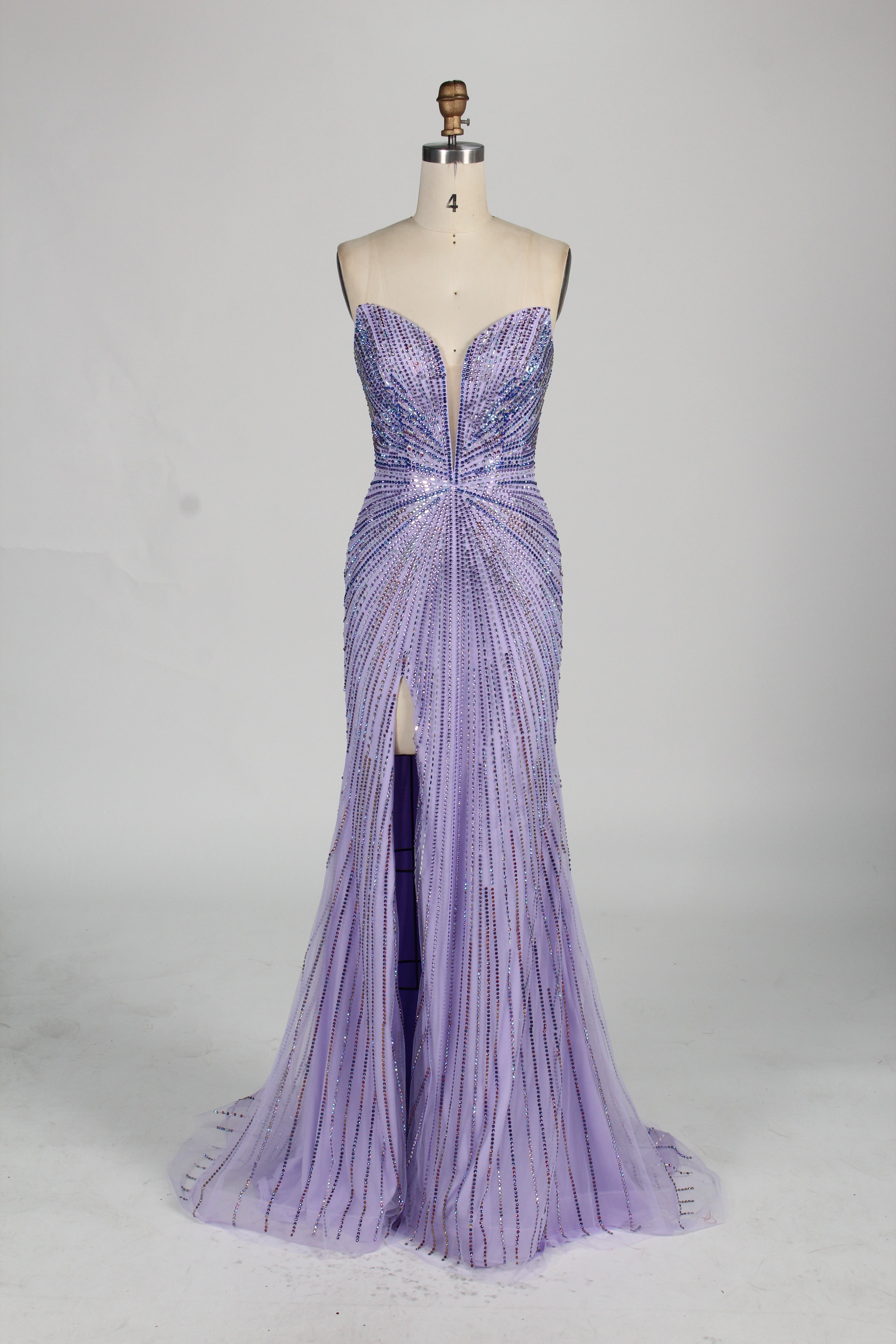photo of a beautiful woman in a stunning blue ball gown with a plunging neckline and thigh-high slit, standing confidently in a studio with soft, diffused lighting, elegant and glamorous, full-length dress with intricate beadwork, long brunette hair styled in an elegant updo, fair skin, red lipstick, high heels, minimalist white background, fashion photography, stylish and sophisticated, no watermarks.KT1432-10