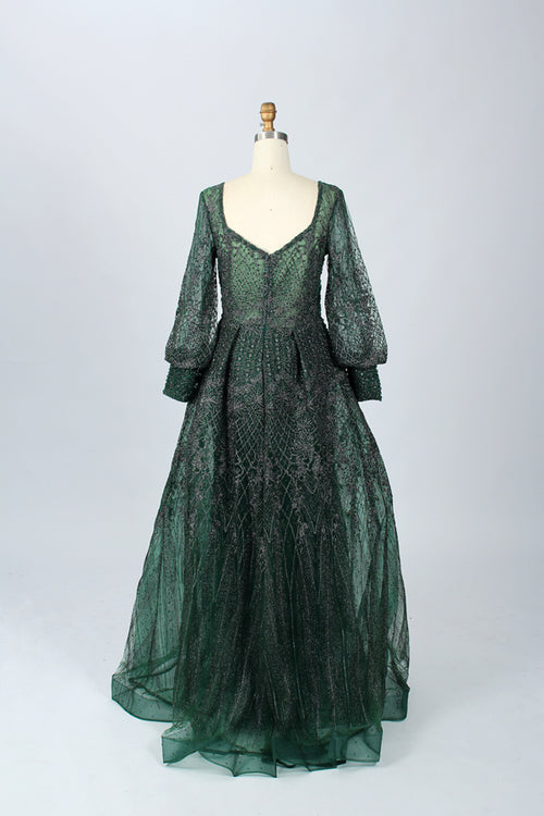 Green beaded lace V-neck dress with gathered waist, long puff sleeves, flared hem.
