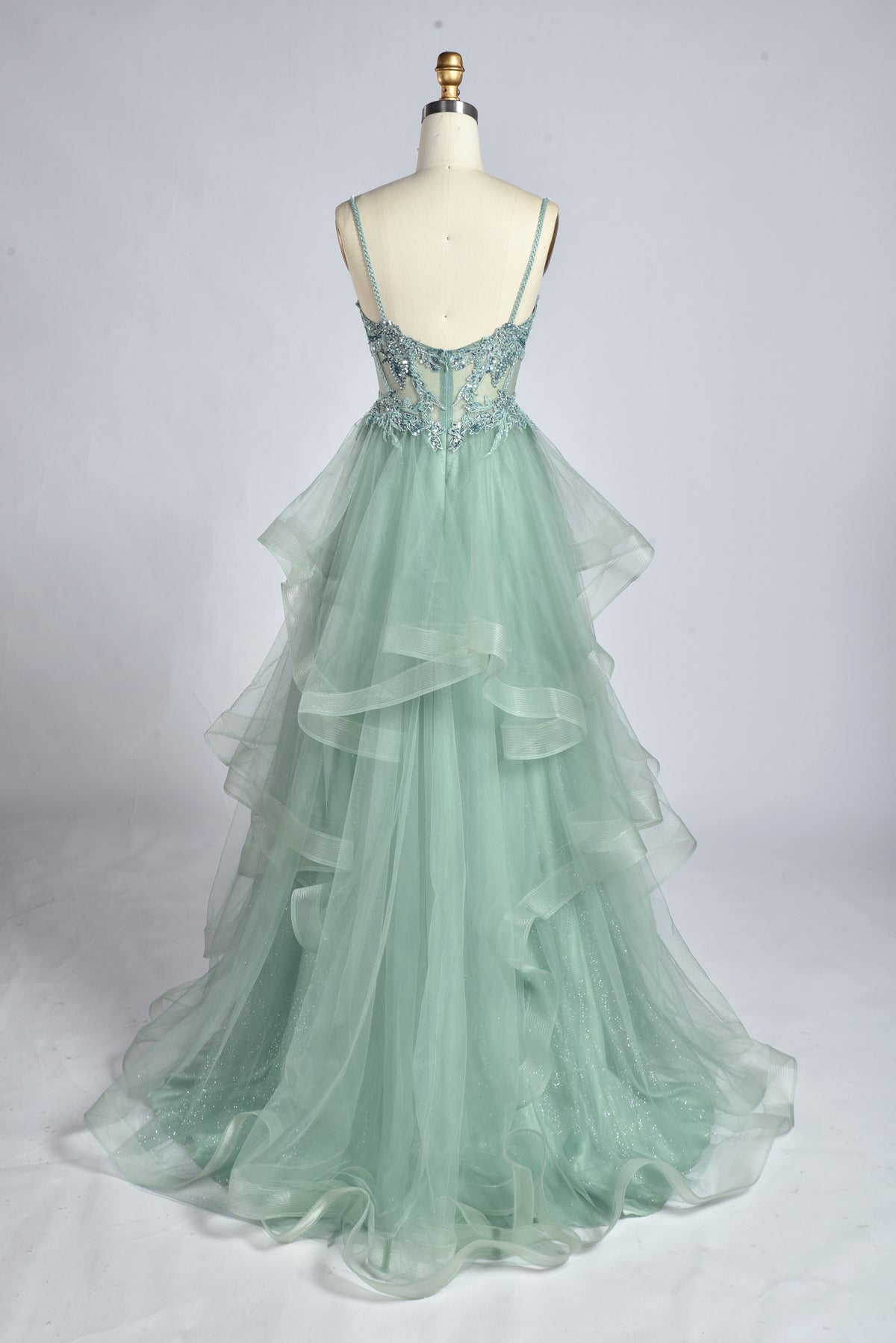 Sage green corset-style strap prom dress, back view, layered ruffle tulle skirt