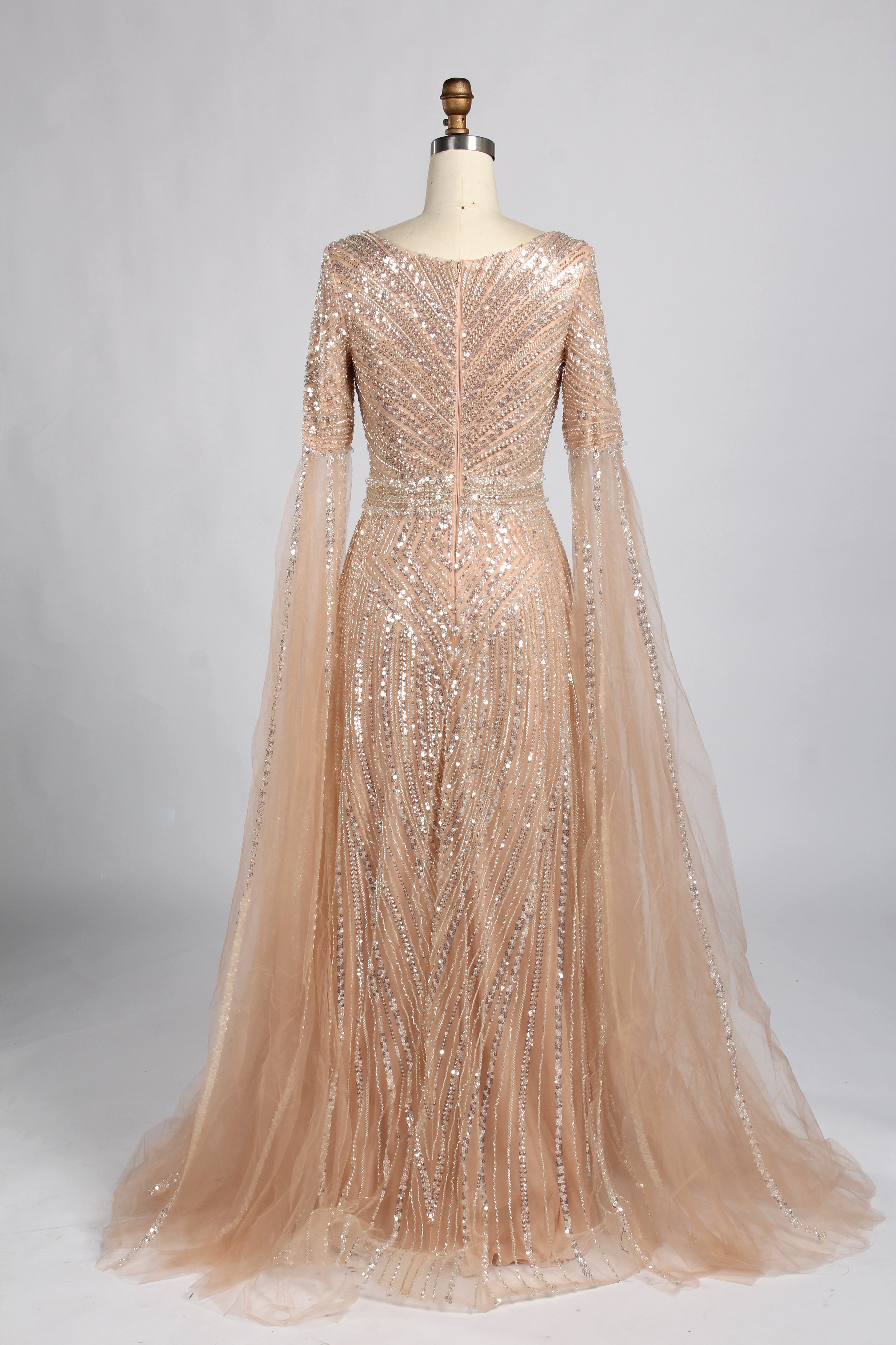 Champagne sequin V-neck evening gown with long cape sleeves and A-line tulle skirt