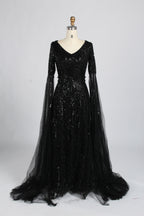 Black sequin V-neck evening gown with long sheer cape sleeves and A-line tulle skirt