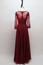 Burgundy beaded gown with illusion neckline and long sheer chiffon sleeves