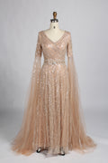 Champagne gold sequin V-neck evening gown with sheer cape sleeves and A-line skirt